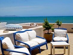 Blue chairs with white cushions